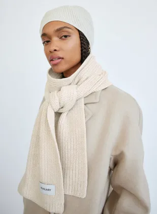 women wearing knitted scarf and hat